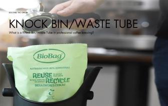 What is a Knock Bin/Waste Tube in professional coffee brewing?